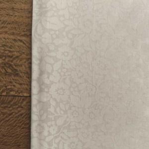 Tissu Faux uni fleurs blanches- 100% Coton -  au mètre