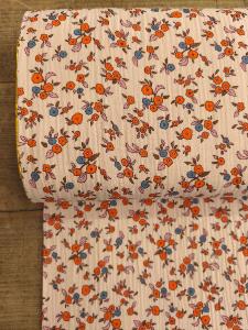 Tissu Double gaze Fantaisie -fond rose fleurs orange- au mètre 