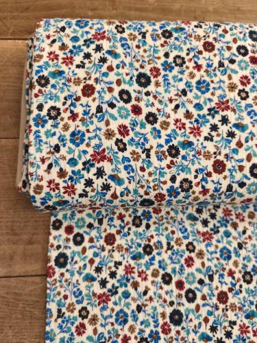 Tissu Double gaze Fantaisie -fond écru fleurs bleues- au mètre 